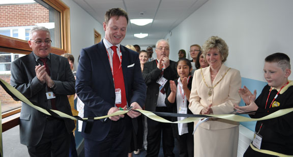 Will Farmer Cuts
        the ribbon to the New Teaching Block